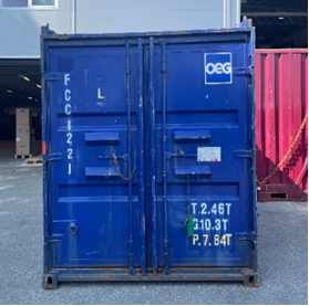 A blue container in front of a building&nbsp; AI-generated content may be incorrect., Picture